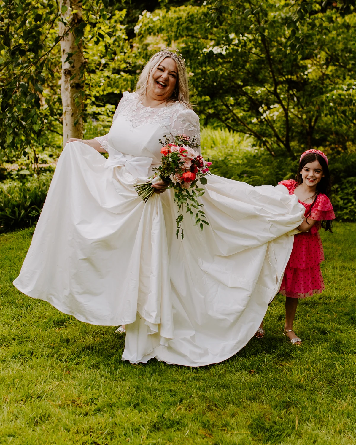 Amelia in her bespoke satin wedding dress with an heirloom lace bodice and full skirt
