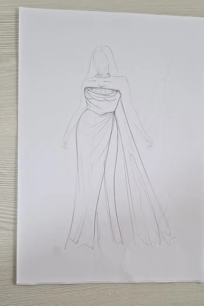 Pencil design sketch of a draped wedding gown with a cowl bodice and a side split