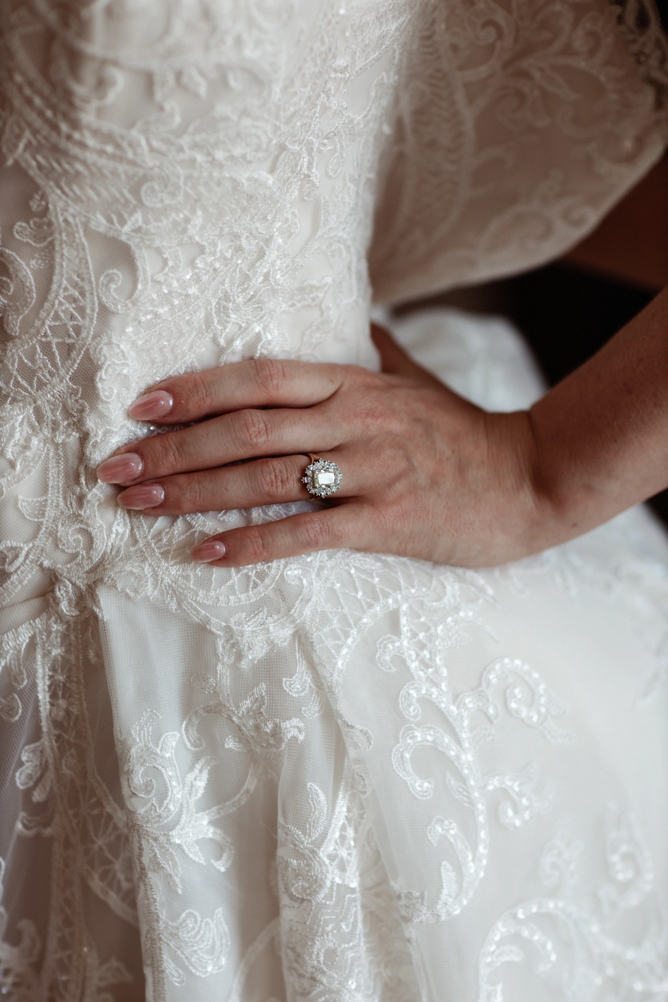 Custom ivory lace ballgown wedding dress, close-up of the beaded lace bodice and skirt
