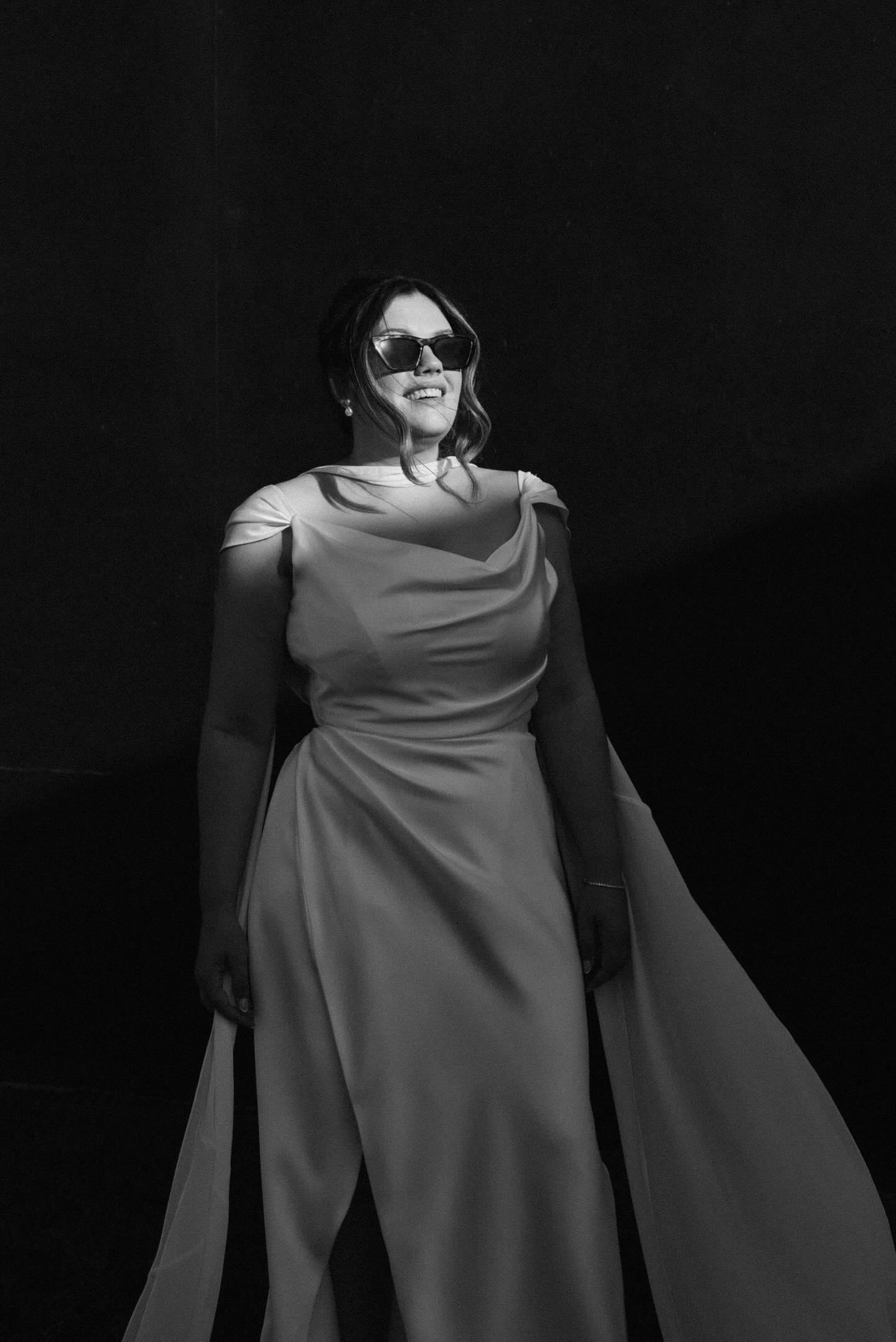 Krystie in her bias-draped satin corset wedding dress with a chiffon cape