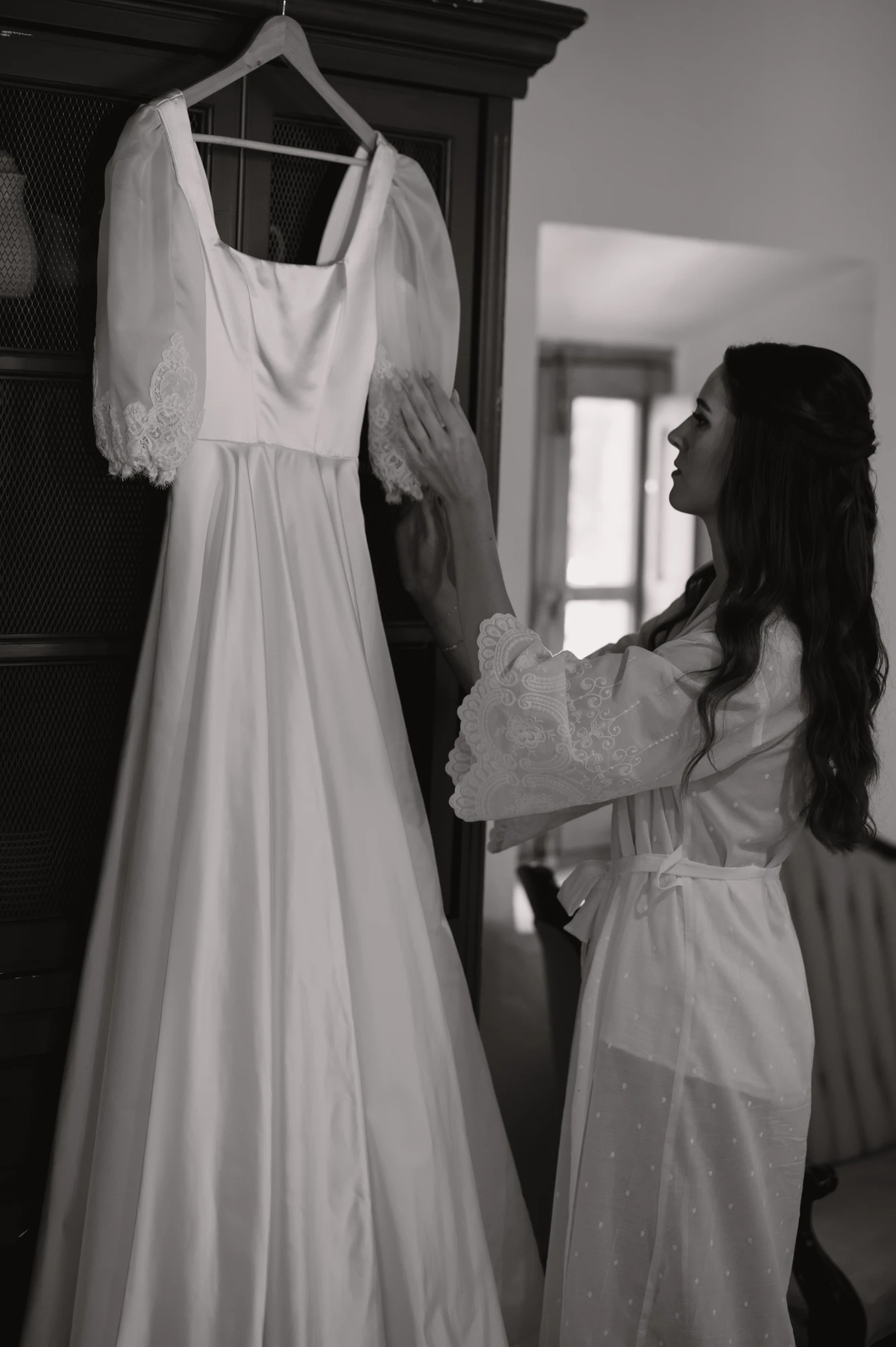 Christina in her duchess satin ballgown wedding dress with mantilla lace veil in Spain