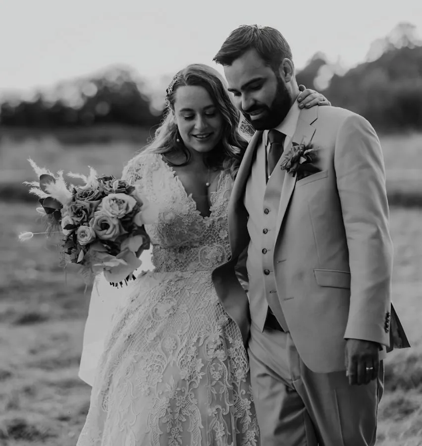 Custom lace ballgown wedding dress with bust support and a cathedral length train