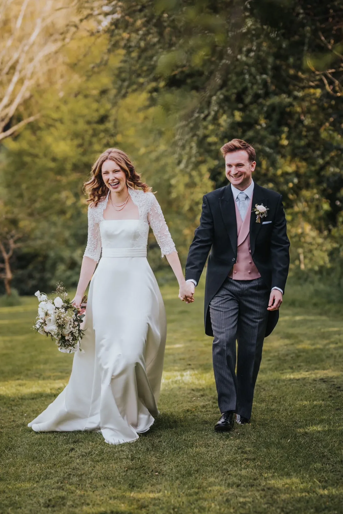 Custom long-sleeve wedding dress with a cotton silk lace neckline, classic style