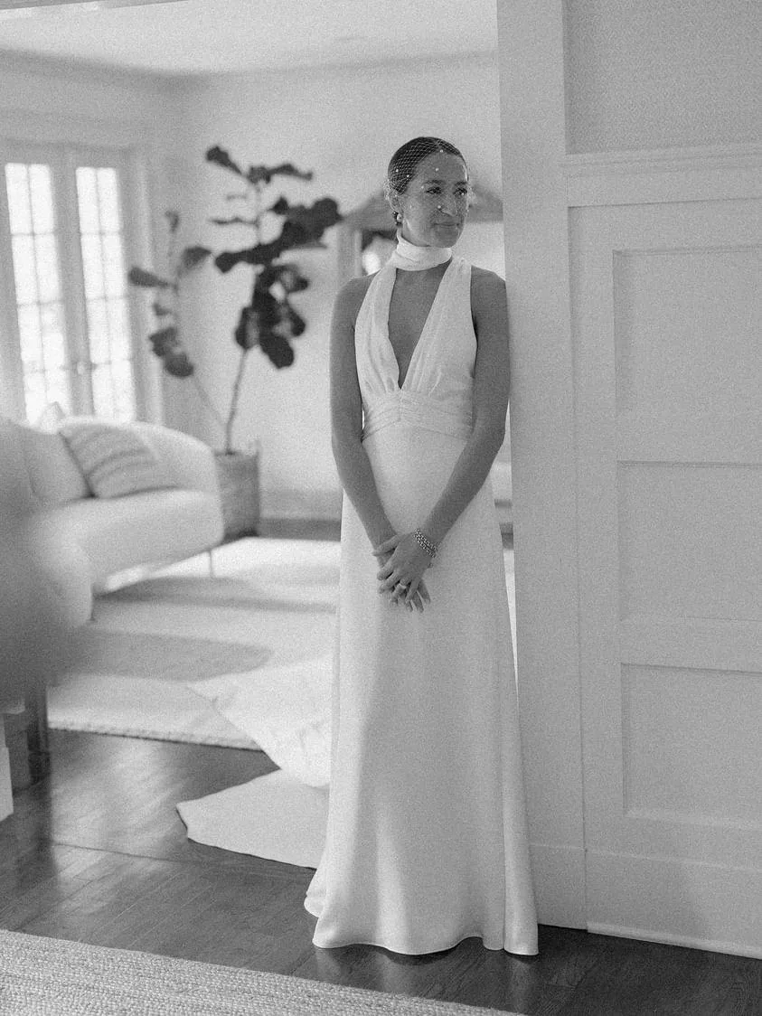 Custom satin crepe halterneck wedding dress with a deep plunge neckline