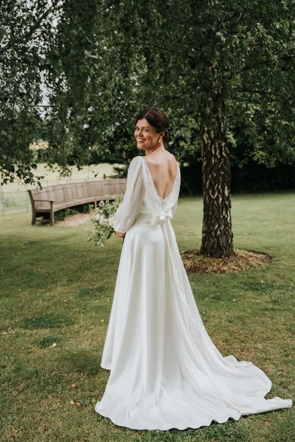 Custom strapless wedding dress with a removable chiffon overlay